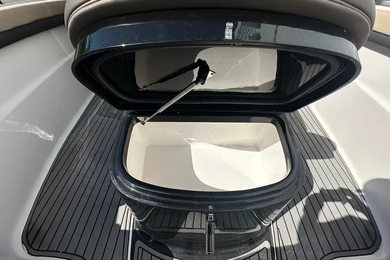 Slide: The Image of Open storage compartment on 2018 Tidewater 320 CC Adventure boat deck. - 18