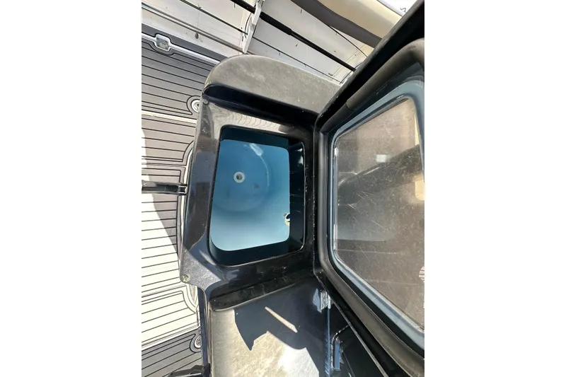 Slide: The Image of 2018 Tidewater 320 CC Adventure boat interior storage compartment. - 19