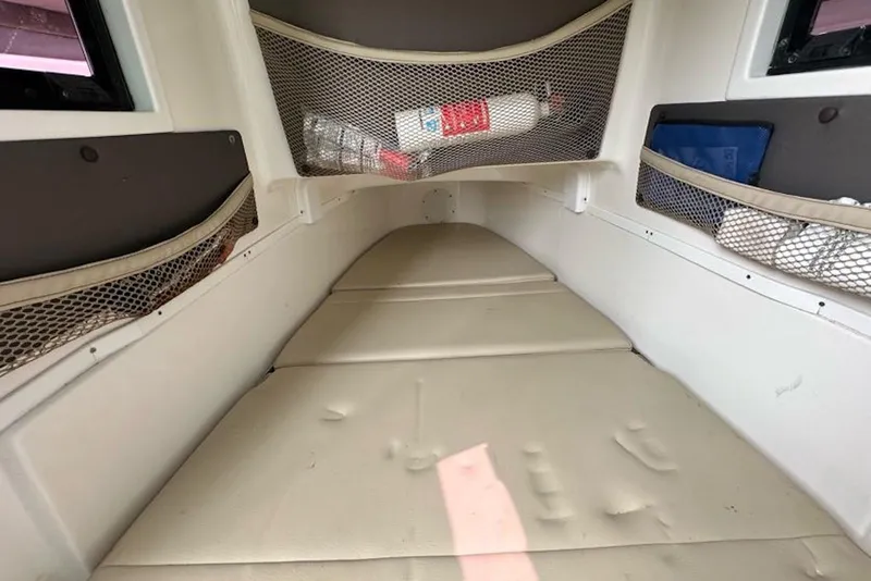 Slide: The Image of 2018 Tidewater 320 CC Adventure cabin interior with storage nets and cushions. - 24