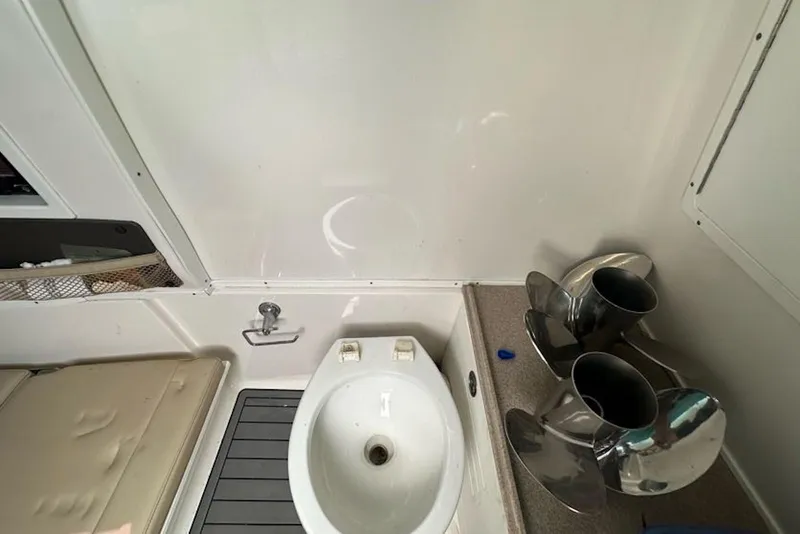 Slide: The Image of 2018 Tidewater 320 CC Adventure boat interior with sink and propellers. - 25