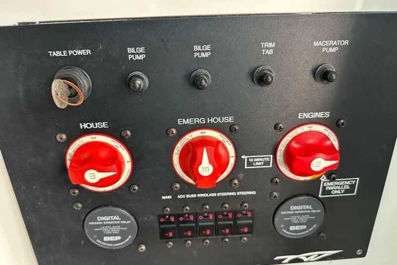 Slide: The Image of Control panel of a 2018 Tidewater 320 CC Adventure boat with switches and dials. - 27