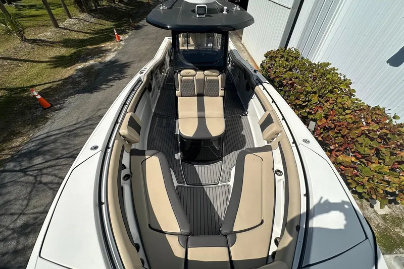 Slide: The Image of 2018 Tidewater 320 CC Adventure boat with spacious seating and sleek design. - 7