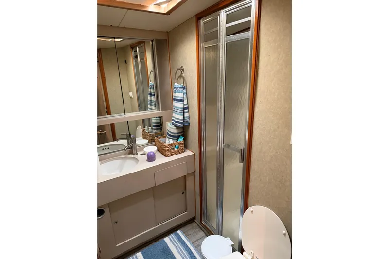 Slide: The Image of Bathroom interior of 1984 Bertram 42 Convertible yacht with shower and vanity. - 22