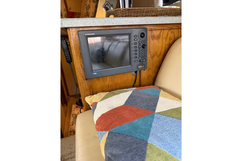 Slide: The Image of Furuno marine electronics on 1984 Bertram 42 Convertible boat with colorful cushion. - 29