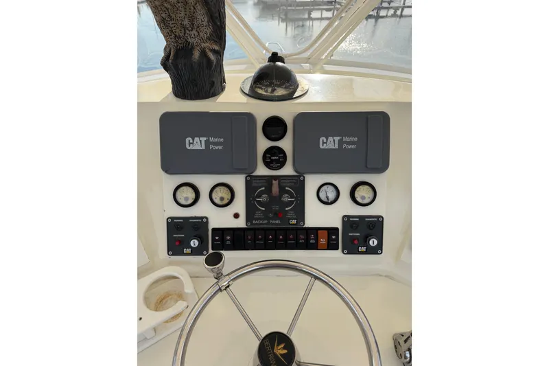 Slide: The Image of Control panel of a 1984 Bertram 42 Convertible boat with CAT Marine Power. - 4