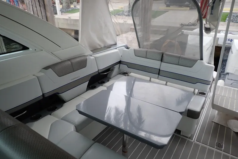 Slide: The Image of 2023 Formula 380 Super Sport Crossover OB interior with sleek seating and modern table design. - 10