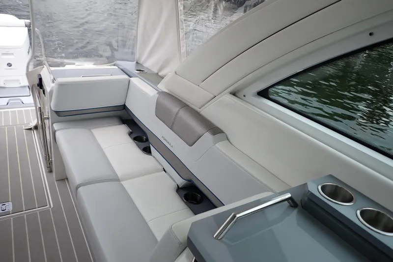 Slide: The Image of 2023 Formula 380 Super Sport Crossover OB interior with luxurious seating and cup holders. - 13