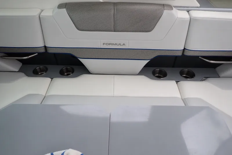 Slide: The Image of 2023 Formula 380 Super Sport Crossover OB interior seating with cup holders and sleek design. - 17