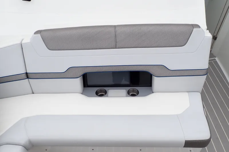 Slide: The Image of 2023 Formula 380 Super Sport Crossover OB boat seating with cup holders and sleek design. - 25