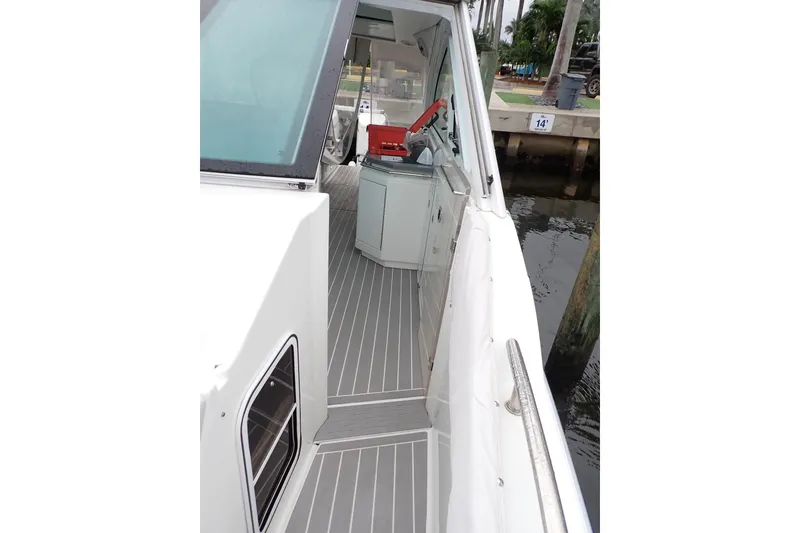 Slide: The Image of 2023 Formula 380 Super Sport Crossover OB boat deck with sleek design and modern features. - 27