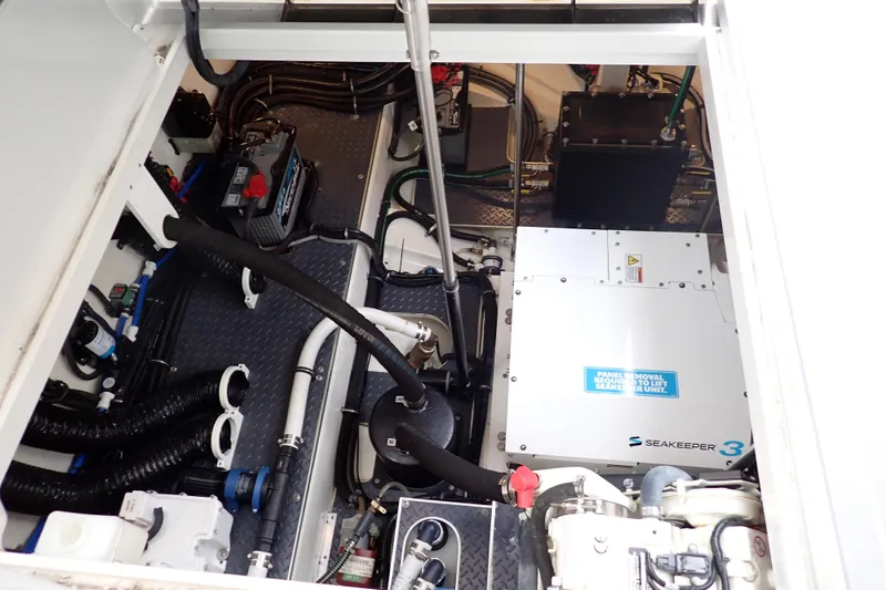 Slide: The Image of Engine compartment of 2023 Formula 380 Super Sport Crossover OB with Seakeeper 3 stabilizer. - 30