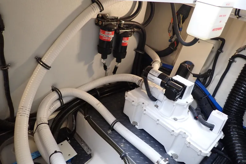 Slide: The Image of Engine room of 2023 Formula 380 Super Sport Crossover OB with hoses and components. - 32