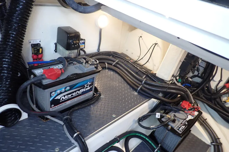 Slide: The Image of Engine compartment of 2023 Formula 380 Super Sport Crossover OB with batteries and wiring. - 34