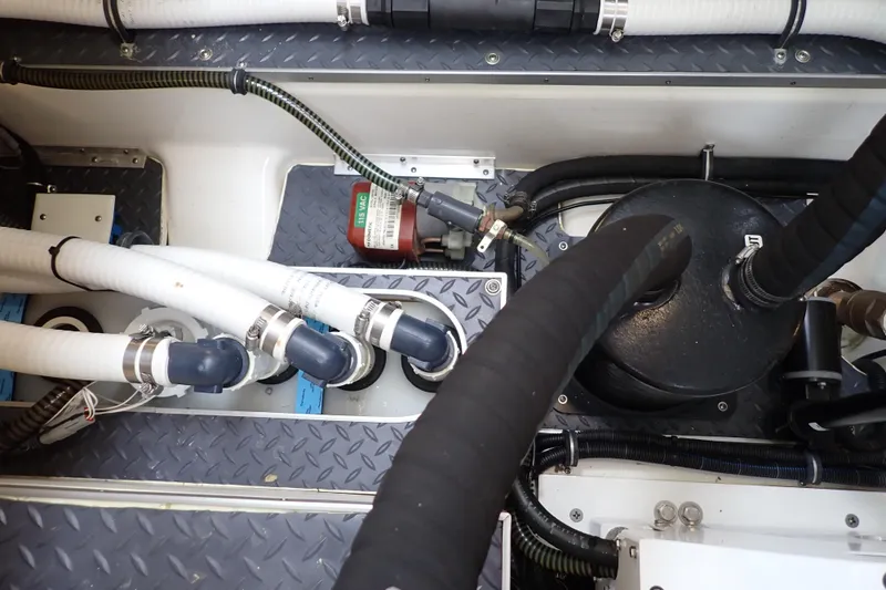 Slide: The Image of Engine compartment of 2023 Formula 380 Super Sport Crossover OB with hoses and components. - 36