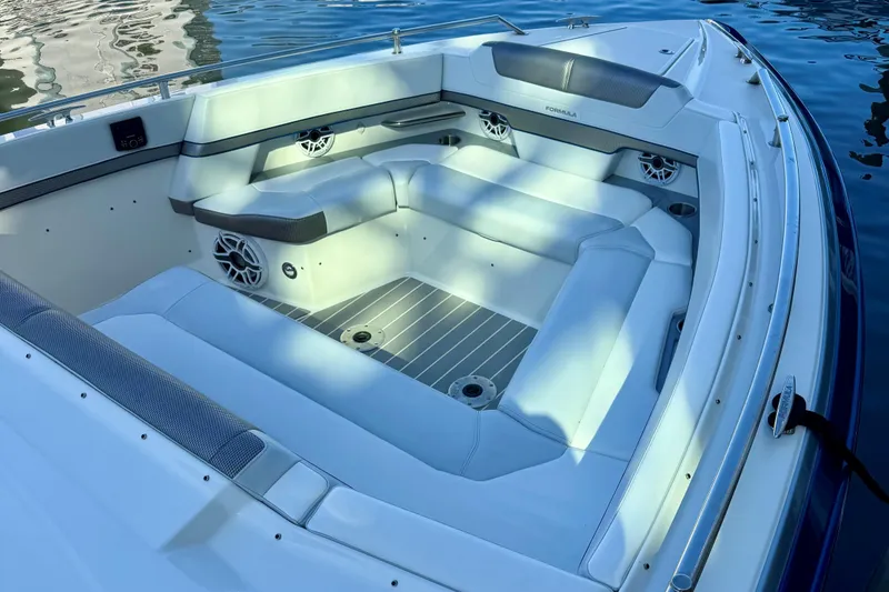 Slide: The Image of 2023 Formula 380 Super Sport Crossover OB boat interior with luxurious seating and modern design. - 4