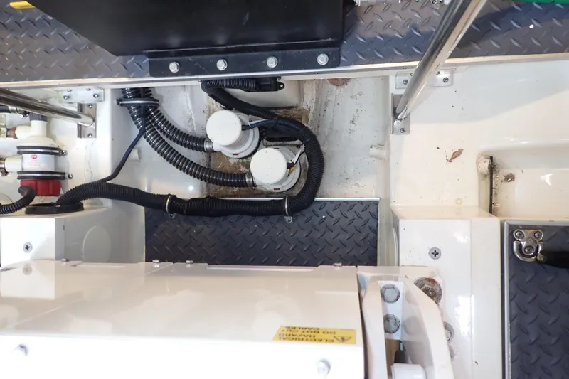 Slide: The Image of Engine compartment of 2023 Formula 380 Super Sport Crossover OB with visible wiring and components. - 40