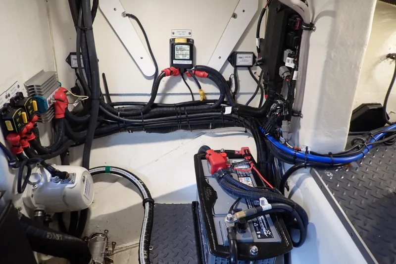 Slide: The Image of 2023 Formula 380 Super Sport Crossover OB engine room with wiring and battery setup. - 41