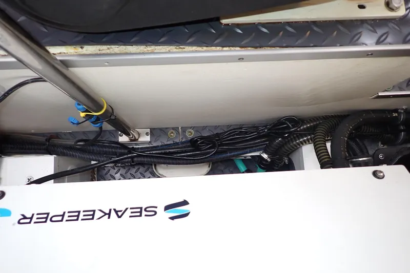 Slide: The Image of Engine compartment of 2023 Formula 380 Super Sport Crossover OB with Seakeeper system. - 44