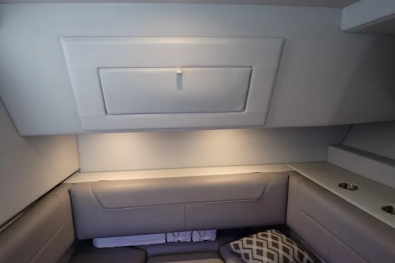 Slide: The Image of 2023 Formula 380 Super Sport Crossover OB cabin interior with seating and storage. - 48