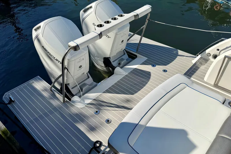 Slide: The Image of 2023 Formula 380 Super Sport Crossover OB with dual Mercury outboard engines on deck. - 5