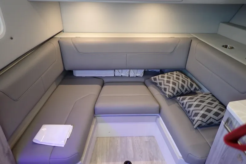 Slide: The Image of 2023 Formula 380 Super Sport Crossover OB interior with gray seating and patterned cushions. - 51