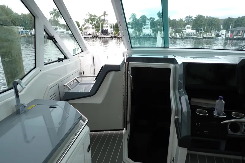 Slide: The Image of Interior view of 2023 Formula 380 Super Sport Crossover OB boat, featuring sleek design and amenities. - 9