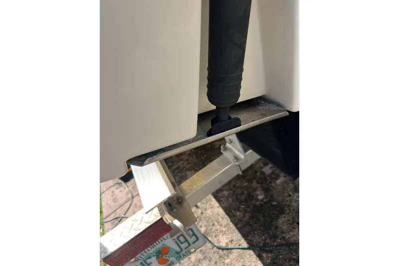 Slide: The Image of 1999 Pursuit 2470 Walkaround boat detail with Florida license plate. - 30