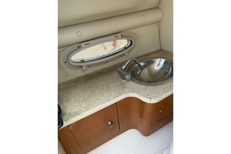 Slide: The Image of 2008 Chaparral 246 SSi boat interior with sink and countertop. - 11