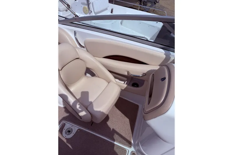 Slide: The Image of 2008 Chaparral 246 SSi boat interior with beige seating and sleek design. - 5