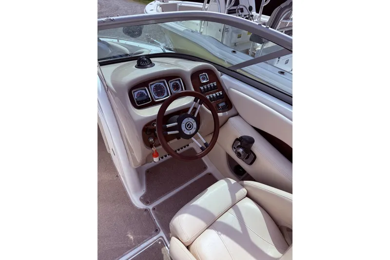 Slide: The Image of 2008 Chaparral 246 SSi boat cockpit with steering wheel and control panel. - 7