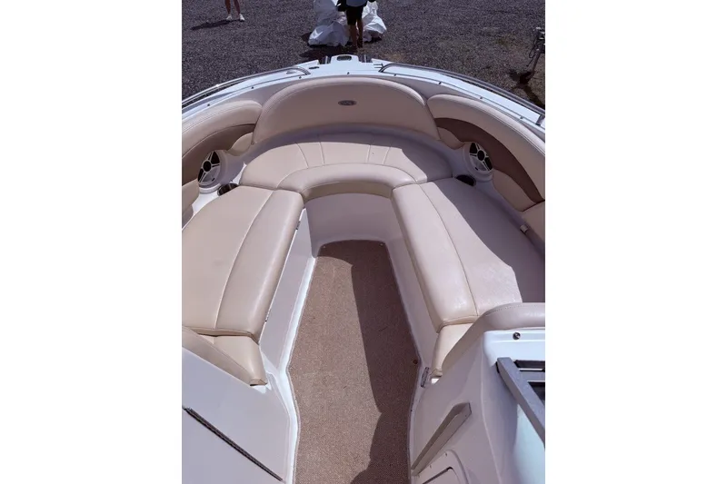 Slide: The Image of 2008 Chaparral 246 SSi boat interior with beige seating and carpeted floor. - 8