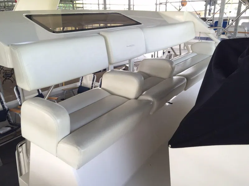 Slide: The Image of Interior of a 1998 Silverton 372 Motor Yacht with white leather seating. - 11