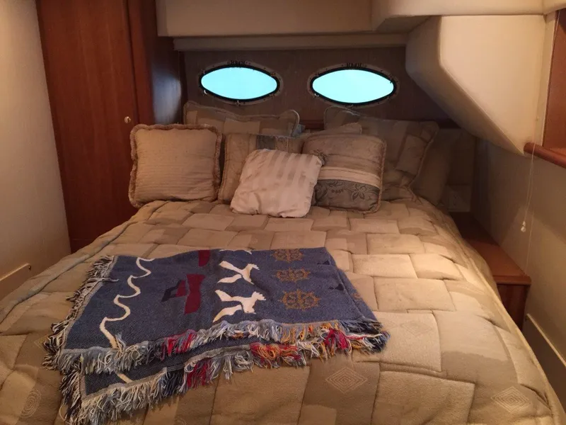 Slide: The Image of Interior of 1998 Silverton 372 Motor Yacht, cozy bedroom with bed. - 28