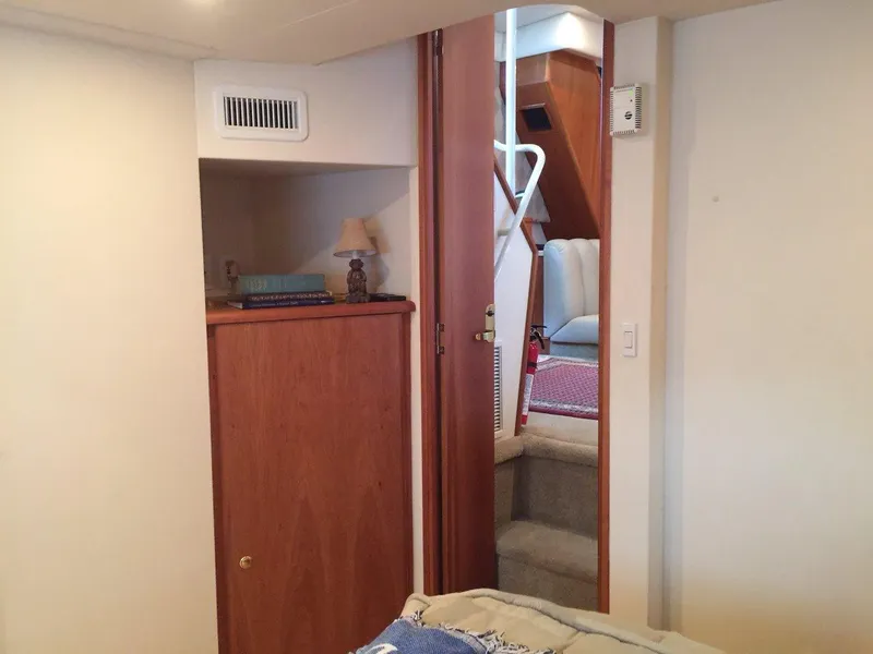 Slide: The Image of Interior of 1998 Silverton 372 Motor Yacht with stairs and wooden furniture. - 29