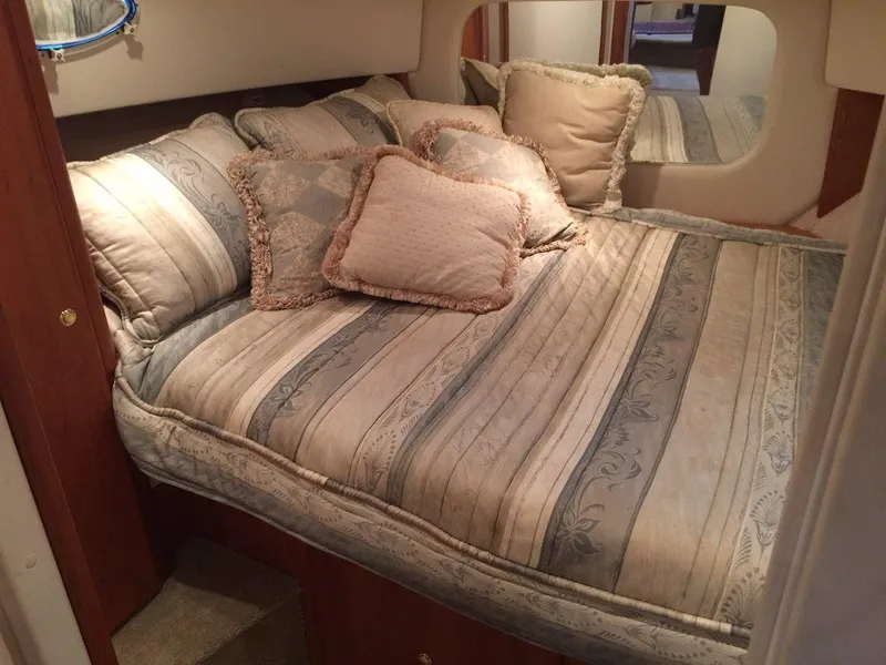 Slide: The Image of Interior of 1998 Silverton 372 Motor Yacht with cozy bed. - 31