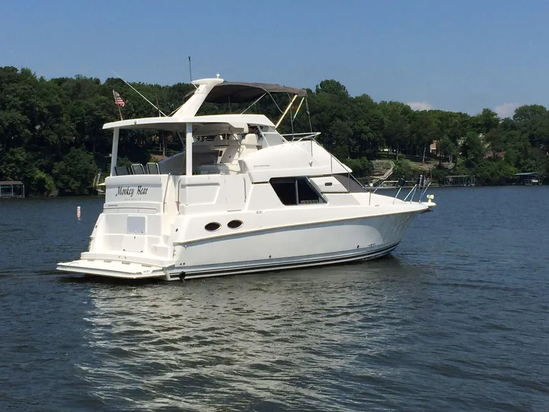 Slide: The Image of 1998 Silverton 372 Motor Yacht on a calm lake. - 5