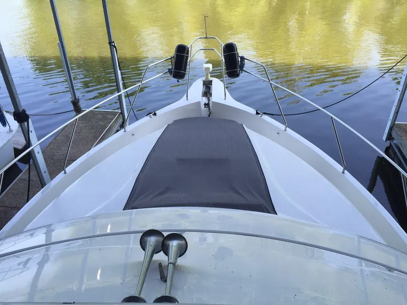 Slide: The Image of 1998 Silverton 372 Motor Yacht at dock, front view. - 8