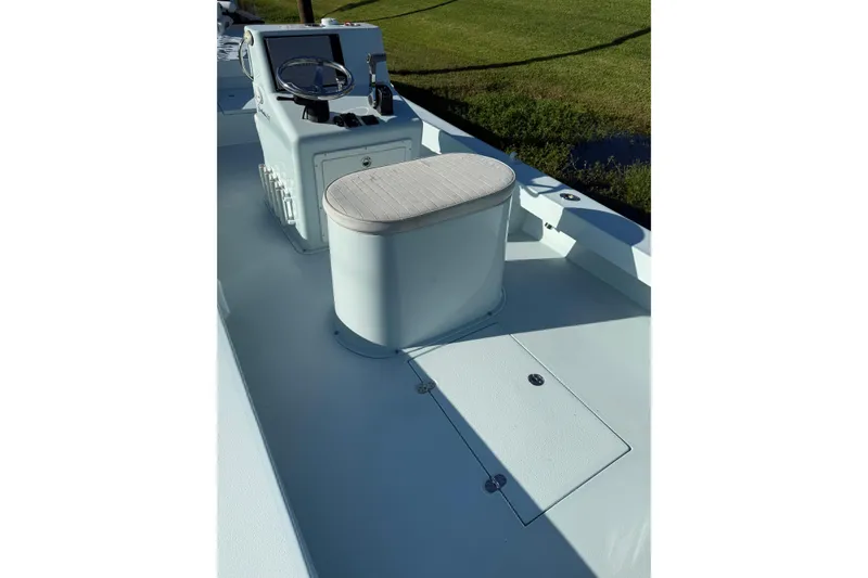 Slide: The Image of 2017 Sabalo 22 boat interior with steering console and cushioned seat. - 10