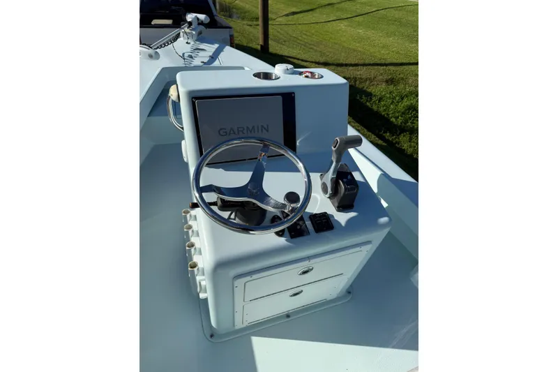 Slide: The Image of 2017 Sabalo 22 boat console with Garmin display and steering wheel. - 11