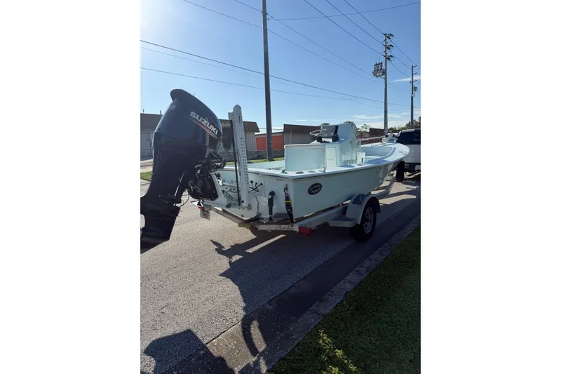 Slide: The Image of 2017 Sabalo 22 boat on trailer with Suzuki outboard motor. - 19