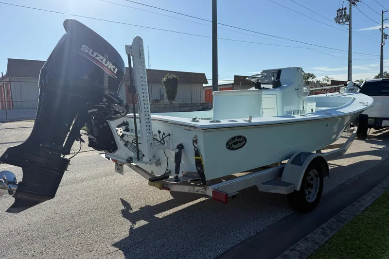 Slide: The Image of 2017 Sabalo 22 boat with Suzuki outboard motor on trailer, parked on street. - 20