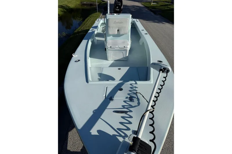 Slide: The Image of 2017 Sabalo 22 boat with center console and trolling motor on a sunny day. - 7