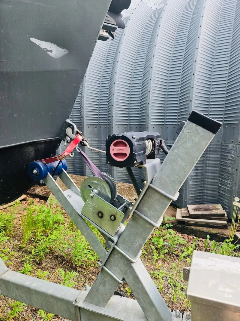 Slide: The Image of Close-up of a 2022 Duck Water Boats Airboat 23 on a trailer. - 14