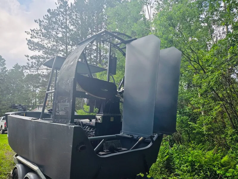 Slide: The Image of Duck Water Boats Airboat 23 from 2022 parked in forest. - 4