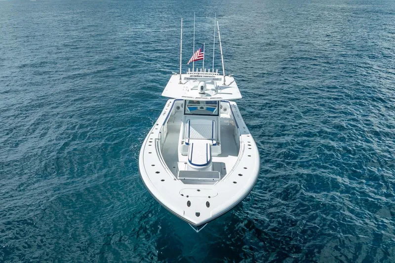 Slide: The Image of 2023 Yellowfin 39 Offshore boat on open water, aerial view. - 10