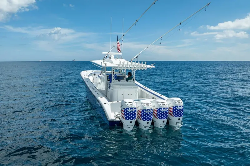 Slide: The Image of 2023 Yellowfin 39 Offshore boat with four engines on open sea. - 16