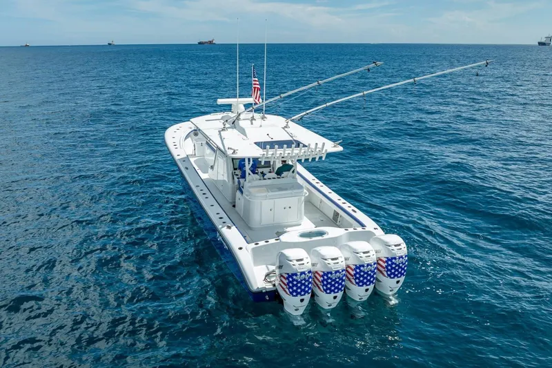 Slide: The Image of 2023 Yellowfin 39 Offshore boat with four engines on open ocean. - 17