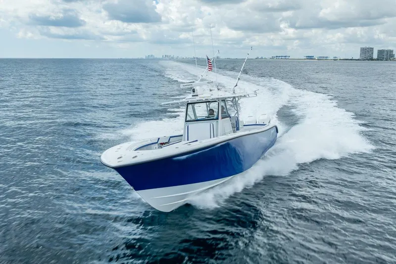 Slide: The Image of 2023 Yellowfin 39 Offshore boat cruising on open water under cloudy skies. - 20