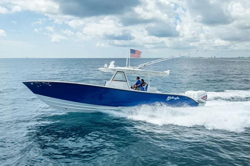 Slide: The Image of 2023 Yellowfin 39 Offshore boat cruising on open ocean under cloudy sky. - 23