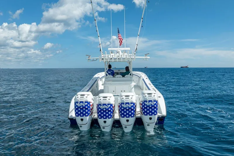 Slide: The Image of 2023 Yellowfin 39 Offshore boat with four powerful outboard engines on open sea. - 3